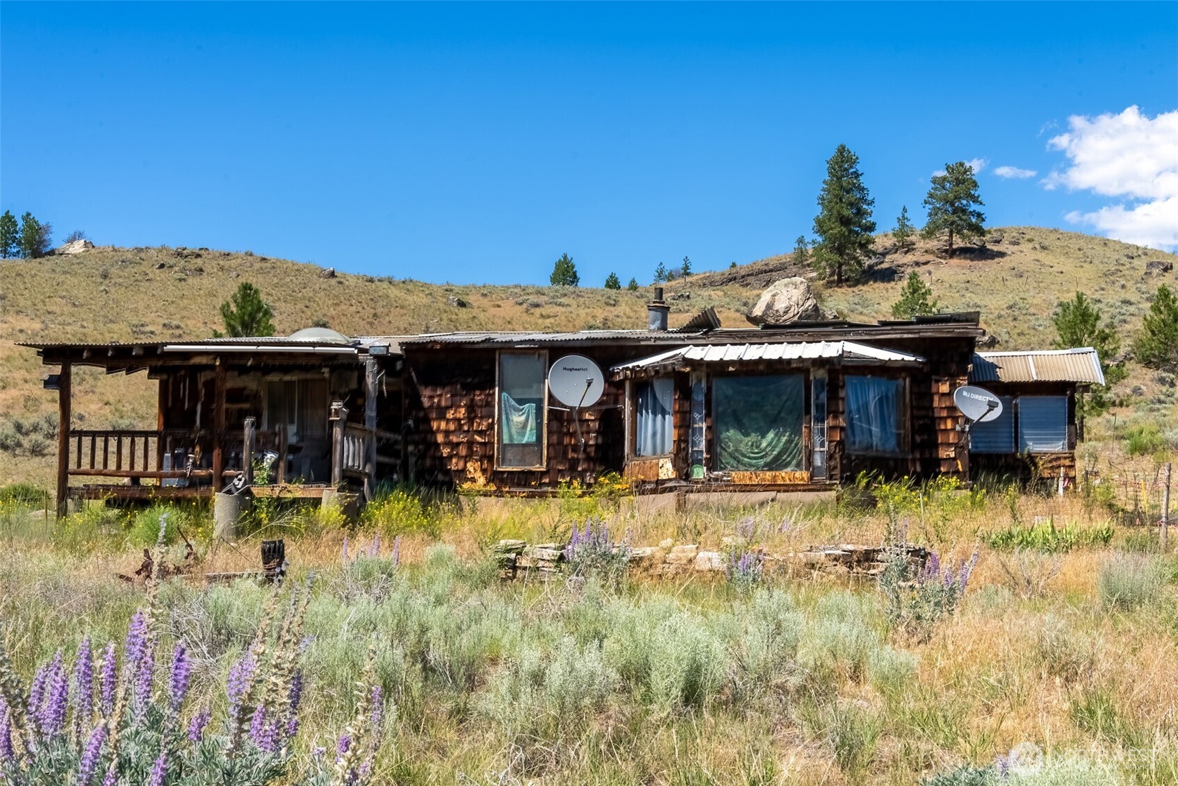 1287 State Rte 20 Tonasket, WA 98855 - Photo 2 of 9 a view of a house with swimming pool and sitting area