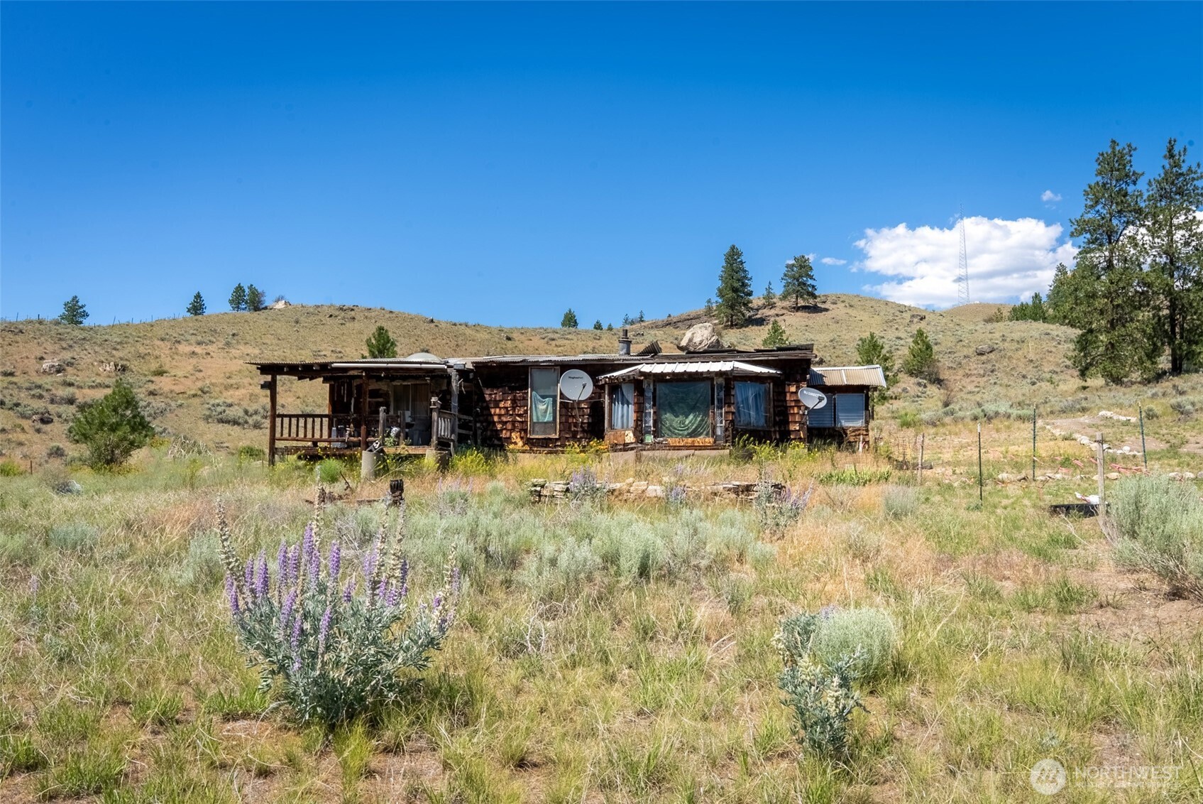 1287 State Rte 20 Tonasket, WA 98855 - Photo 3 of 9 a view of a house with a yard