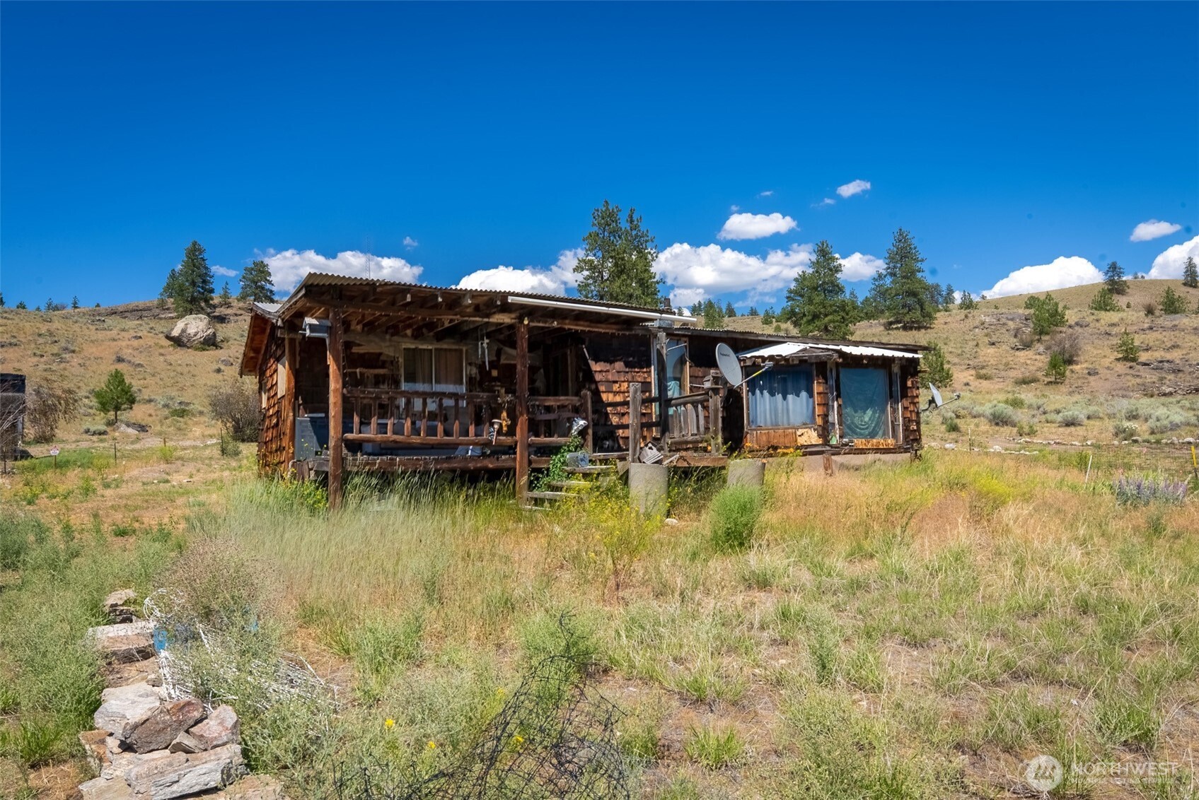 1287 State Rte 20 Tonasket, WA 98855 - Photo 6 of 9 a view of a house with swimming pool