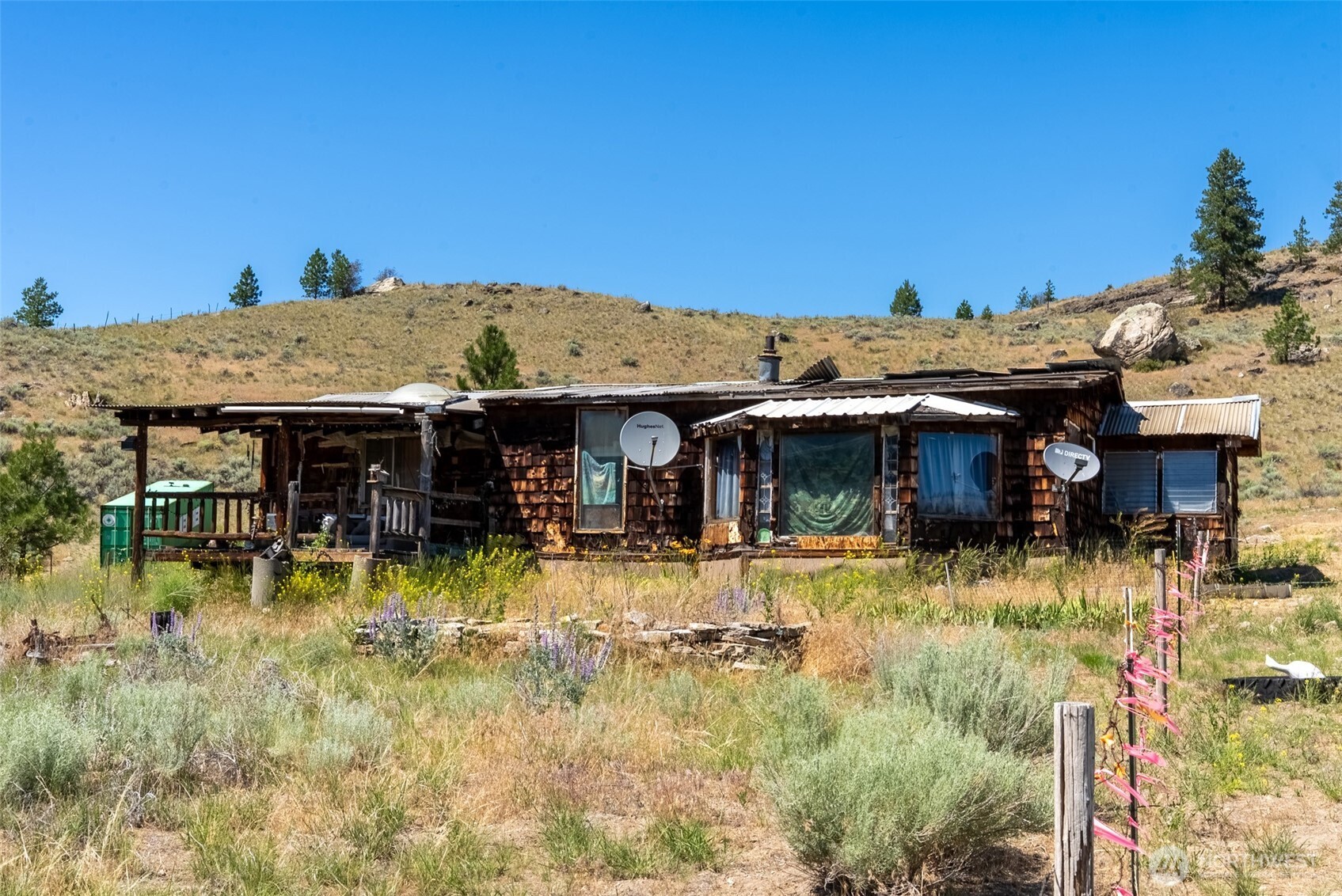 1287 State Rte 20 Tonasket, WA 98855 - Photo 7 of 9 a view of a house with a swimming pool