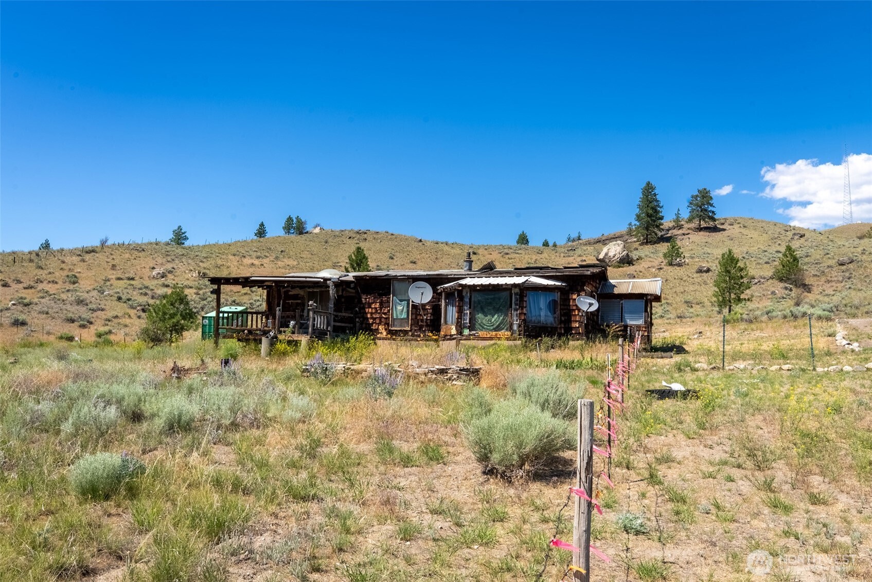 1287 State Rte 20 Tonasket, WA 98855 - Photo 8 of 9 a view of a house with a yard