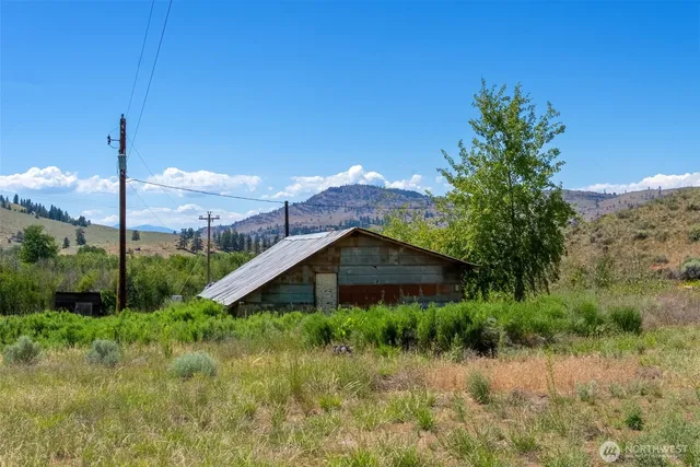 a view of a house with a yard and plants