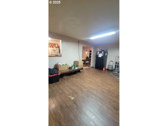 a living room with a couch and a dining table