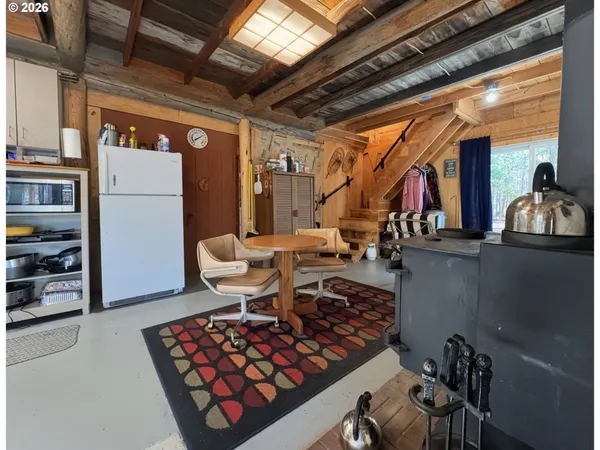 a view of a livingroom with furniture and staircase