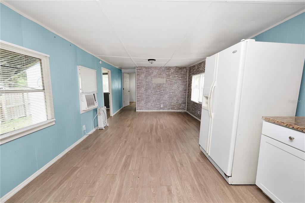 829 Nashville Road Lakeland, FL 33815 - Photo 15 of 30 a view of empty room with wooden floor and window