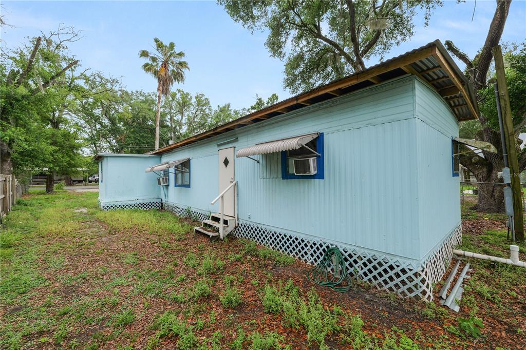 829 Nashville Road Lakeland, FL 33815 - Photo 28 of 30 a backyard of a house with lots of green space