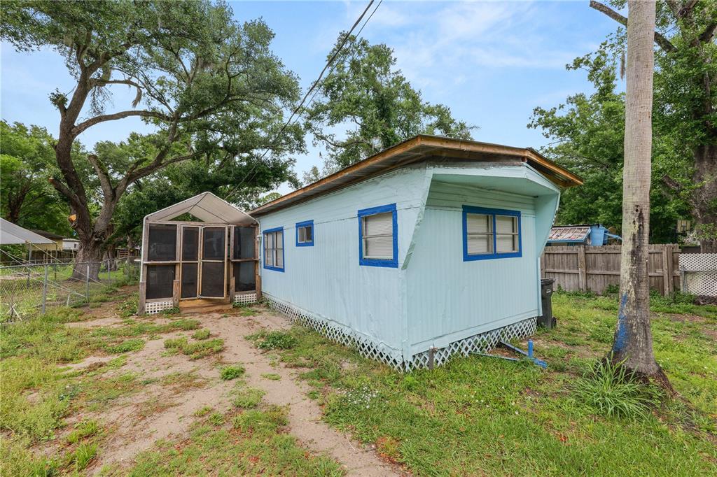 829 Nashville Road Lakeland, FL 33815 - Photo 3 of 30 a house with green field in front of it
