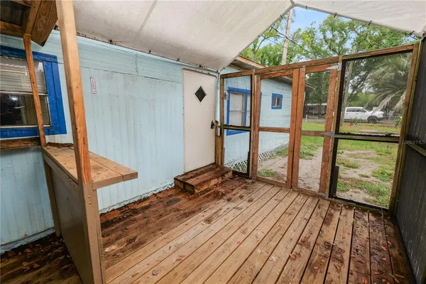 a view of balcony with wooden floor
