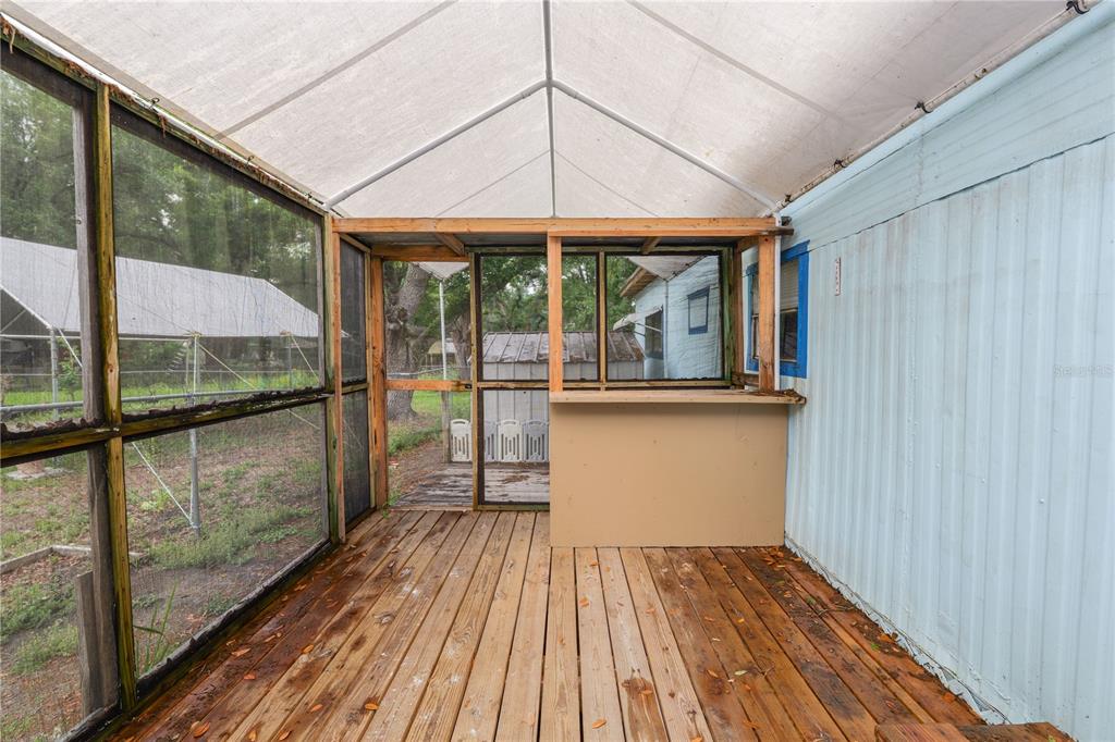 829 Nashville Road Lakeland, FL 33815 - Photo 7 of 30 a view of a balcony with wooden floor
