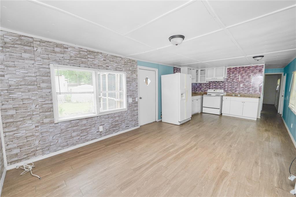 829 Nashville Road Lakeland, FL 33815 - Photo 10 of 30 a view of empty room with a kitchen and a window