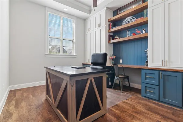a view of cabinets with wooden floor