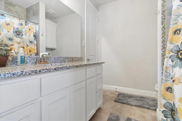 a bathroom with a sink a vanity and a mirror