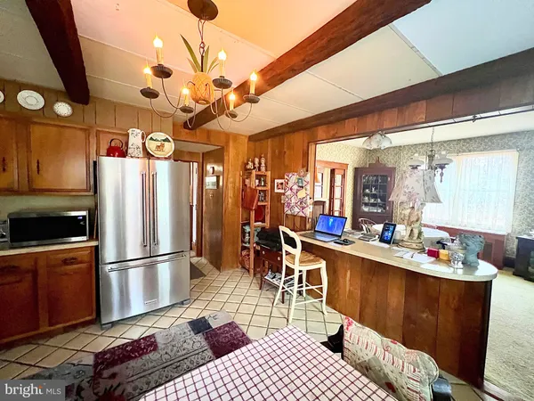 a kitchen with a refrigerator and a sink