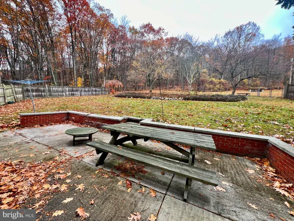 a view of a yard with outdoor seating
