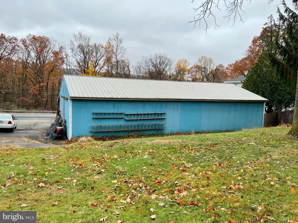 a view of a cars park on the side of a road