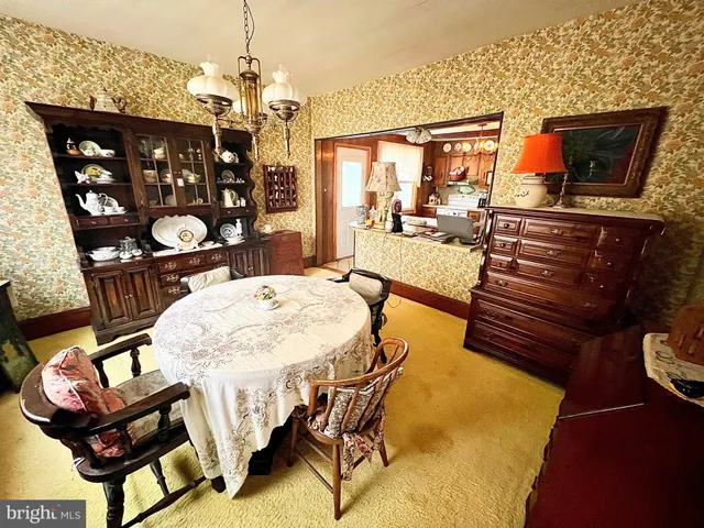 a bedroom with a bed window and a desk