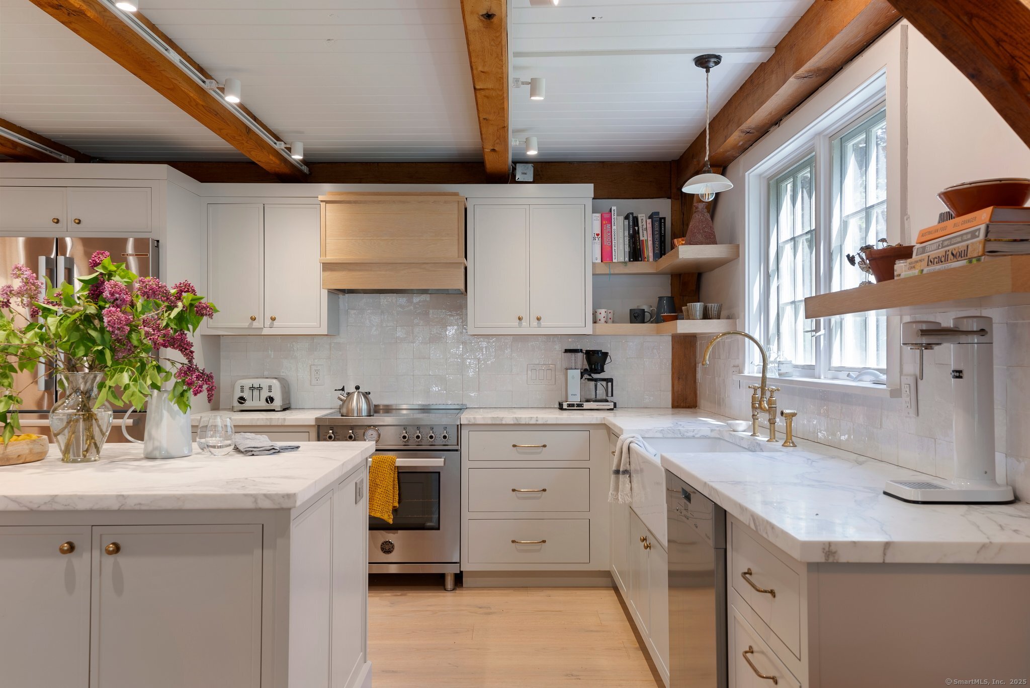 a kitchen with a sink stove and cabinets
