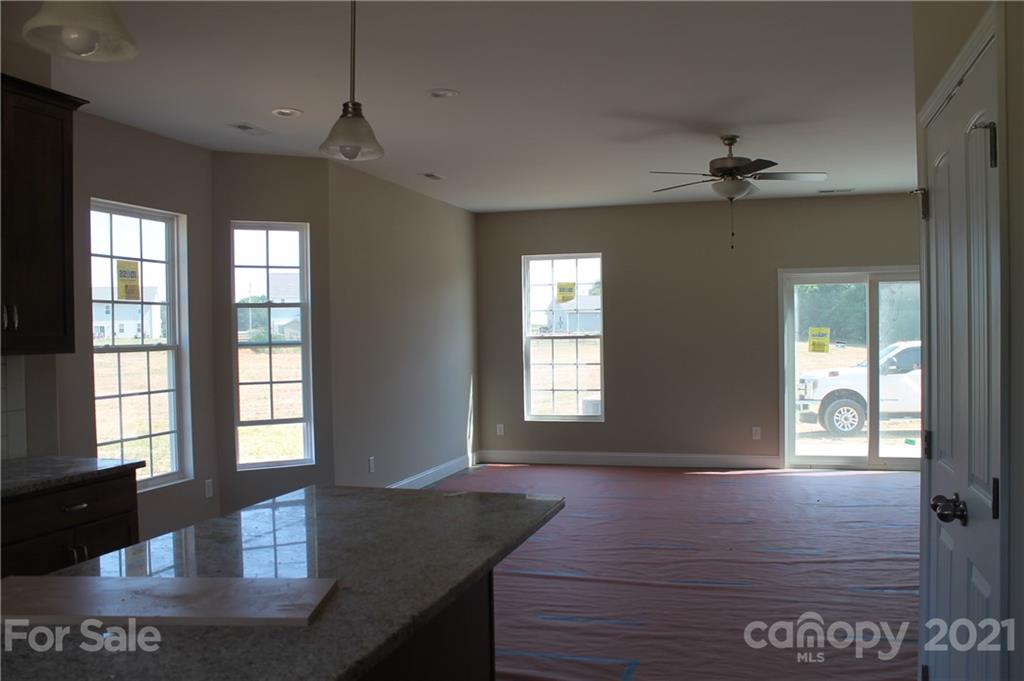 4809 Stack Road Monroe, NC 28112 - Photo 4 of 6 a view of a livingroom with furniture window and wooden floor
