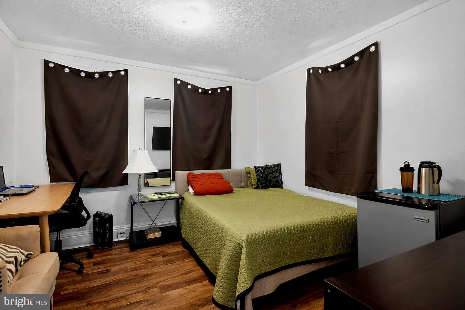 236 Kossuth Street Riverside, NJ 08075 - Photo 14 of 18 a bedroom with a bed and a mirror