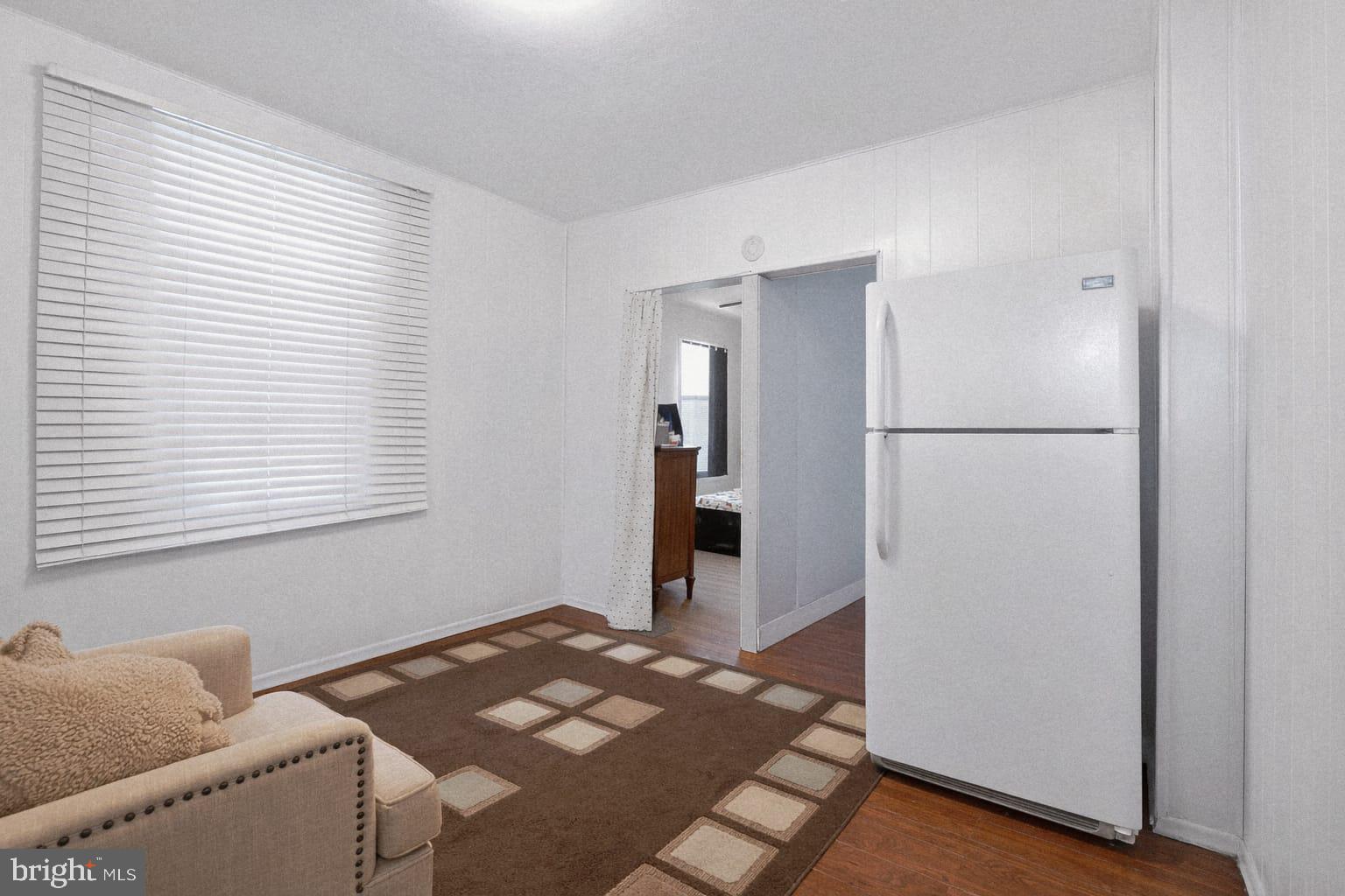 236 Kossuth Street Riverside, NJ 08075 - Photo 4 of 18 a bedroom with a bed and a window