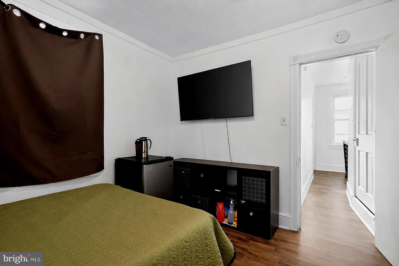 236 Kossuth Street Riverside, NJ 08075 - Photo 10 of 18 a living room with a flat screen tv and a fireplace