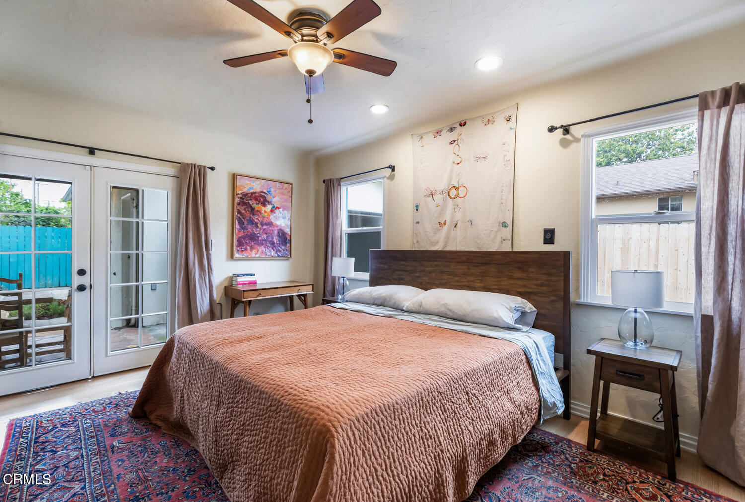 1419 Alpha Avenue Pasadena, CA 91104 - Photo 19 of 40 a bedroom with a bed and a chandelier