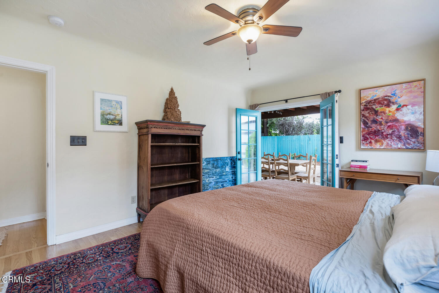 1419 Alpha Avenue Pasadena, CA 91104 - Photo 21 of 40 a bedroom with a bed and a chandelier