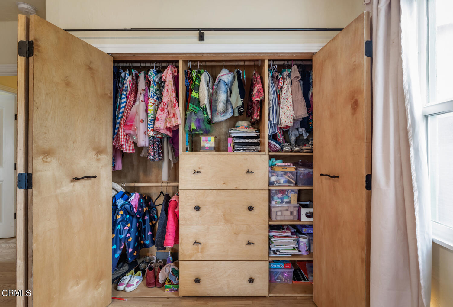 1419 Alpha Avenue Pasadena, CA 91104 - Photo 30 of 40 a view of walk in closet with clothes and shoes