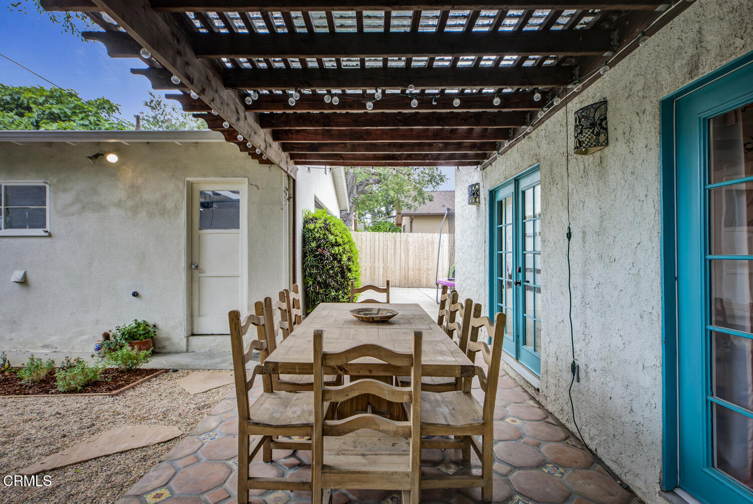 1419 Alpha Avenue Pasadena, CA 91104 - Photo 31 of 40 a table and chairs in front of a door