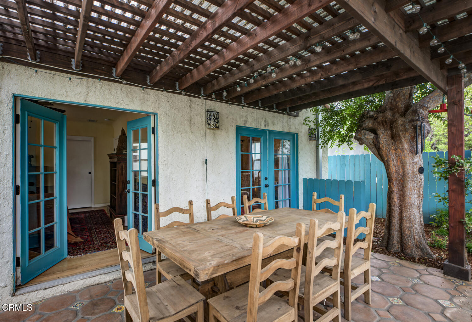 1419 Alpha Avenue Pasadena, CA 91104 - Photo 34 of 40 a patio with a table and chairs with potted plants and a barbeque grill