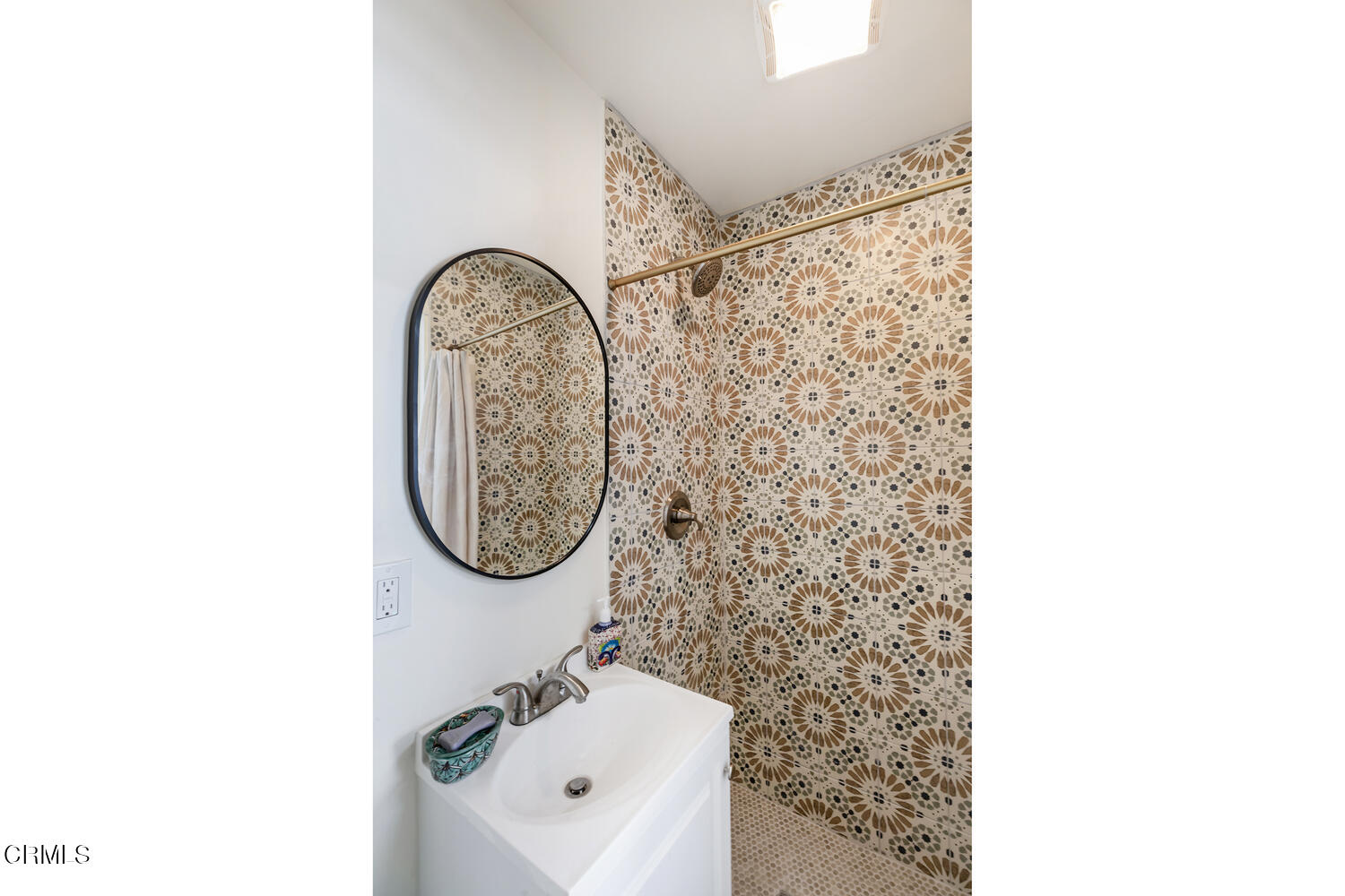 1419 Alpha Avenue Pasadena, CA 91104 - Photo 39 of 40 a bathroom with a sink a mirror and a shower curtain