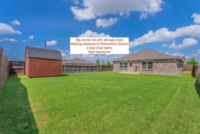 a view of a house with a big yard potted plants and a fireplace