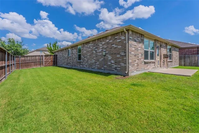 a view of a backyard with a garden