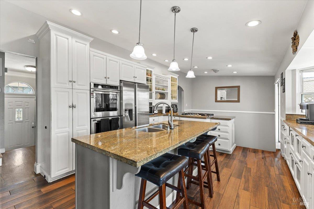 4457 Graywhaler Lane Rohnert Park, CA 94928 - Photo 10 of 51 a kitchen with a table chairs refrigerator and microwave