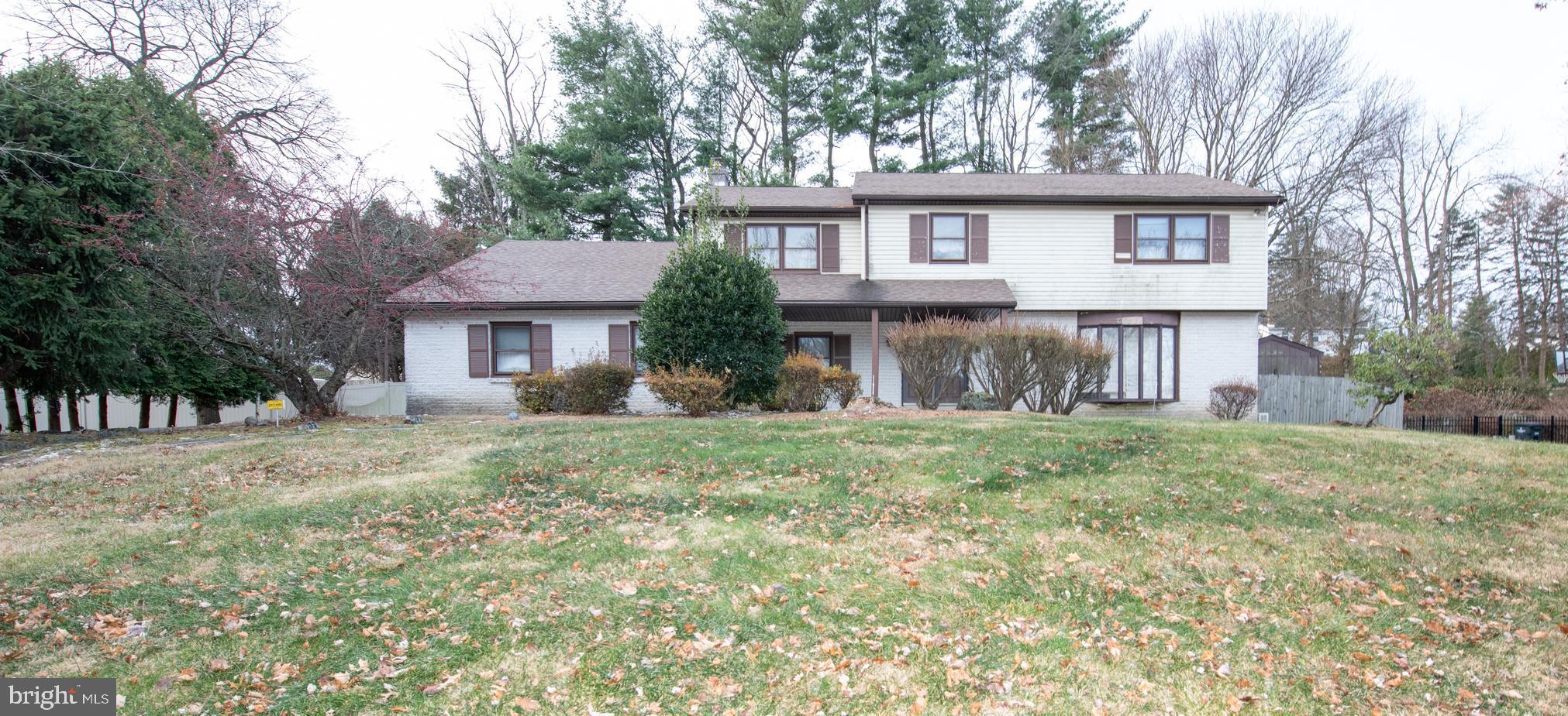 1210 Mettler Road Huntingdon Valley, PA 19006 - Photo 1 of 24 a front view of a house with a yard and garage