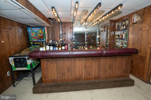 a view of an entryway with a table and chairs