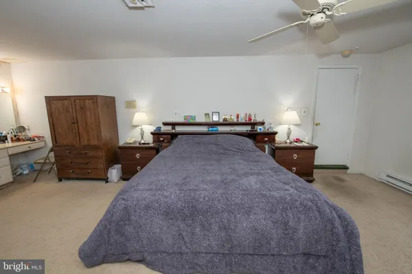 a bed room with a bed and a television