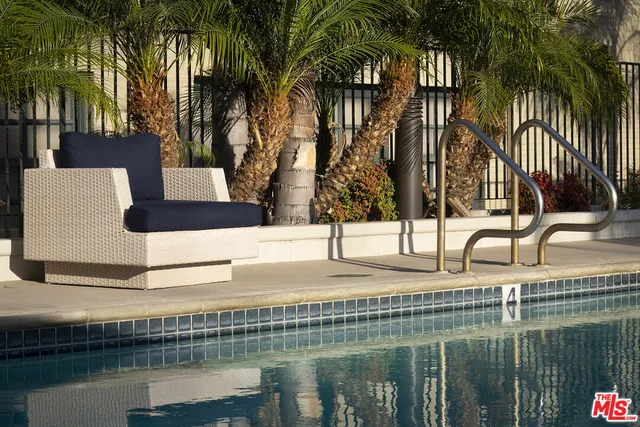 a view of an outdoor sitting area with furniture and backyard