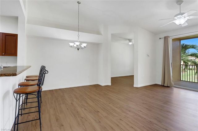a view of a livingroom with furniture and a chandelier