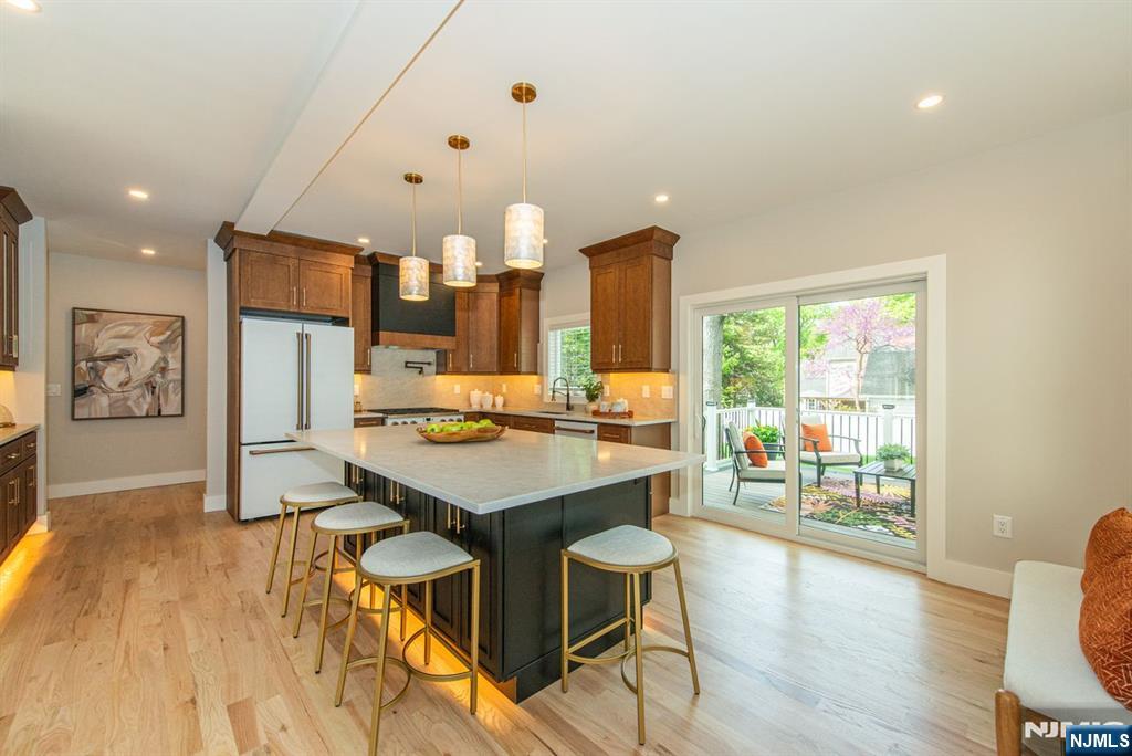 43 Alexander Avenue Montclair, NJ 07043 - Photo 13 of 50 a living room with dining table wooden floor and a large window