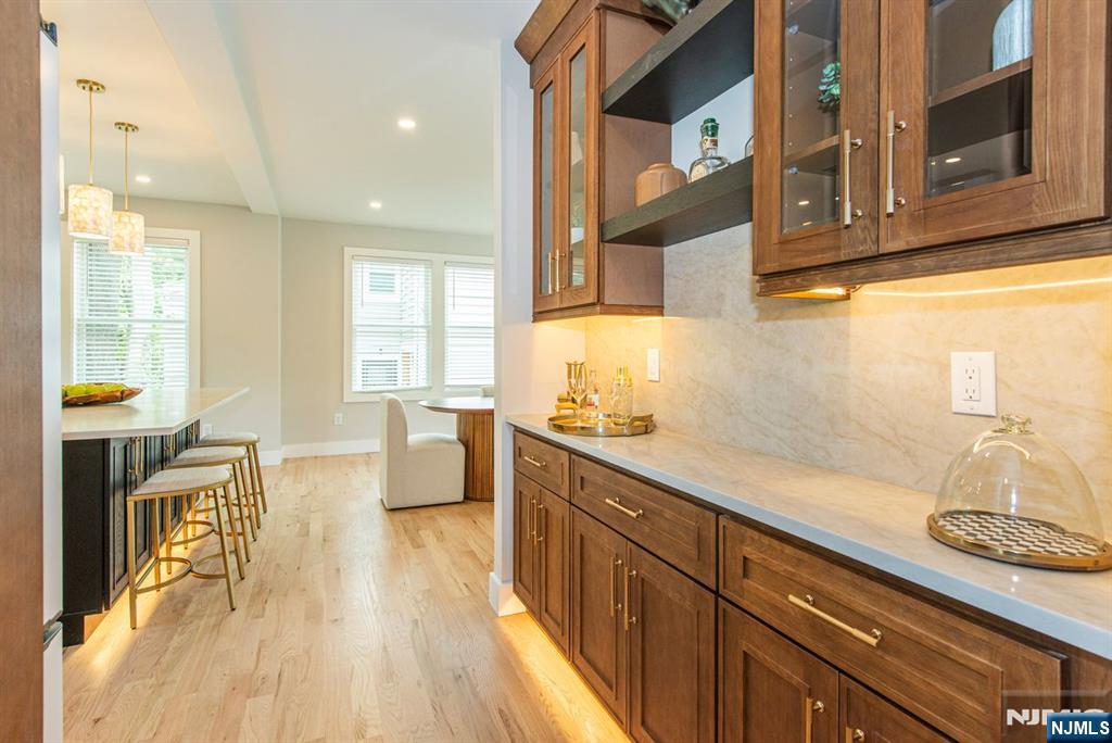 43 Alexander Avenue Montclair, NJ 07043 - Photo 16 of 50 a kitchen with stainless steel appliances granite countertop a sink dishwasher stove and wooden cabinets