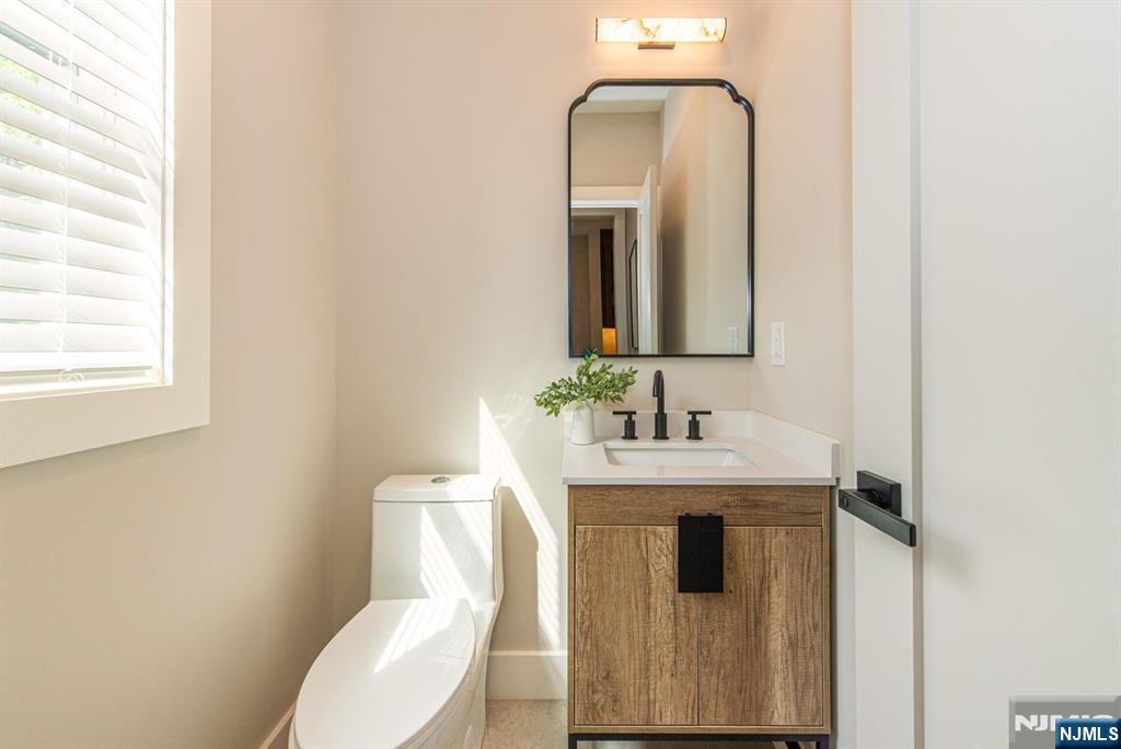 43 Alexander Avenue Montclair, NJ 07043 - Photo 18 of 50 a bathroom with a toilet sink and mirror