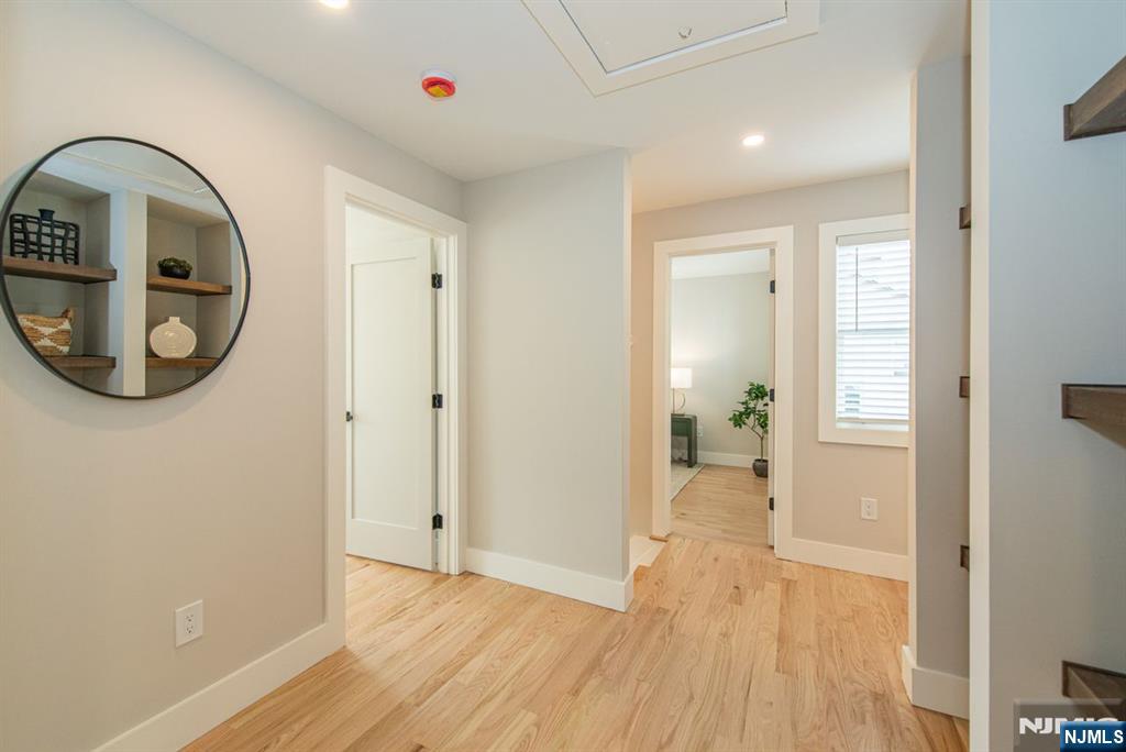 43 Alexander Avenue Montclair, NJ 07043 - Photo 20 of 50 wooden floor in a hall with a window