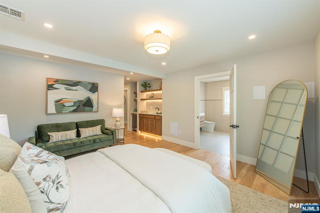 43 Alexander Avenue Montclair, NJ 07043 - Photo 24 of 50 a bedroom with a bed and a mirror