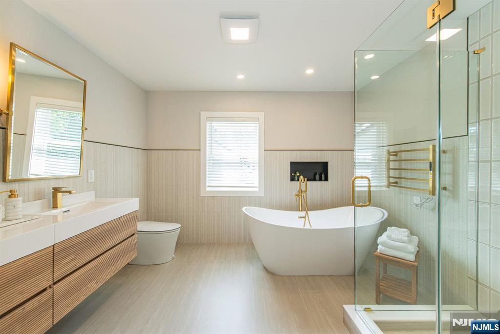 43 Alexander Avenue Montclair, NJ 07043 - Photo 25 of 50 a spacious bathroom with a double vanity sink mirror and bathtub