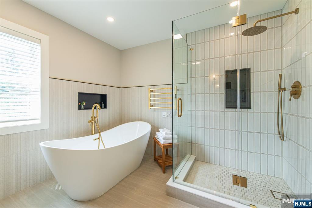 43 Alexander Avenue Montclair, NJ 07043 - Photo 26 of 50 a bathroom with a white bath tub a shower and a sink