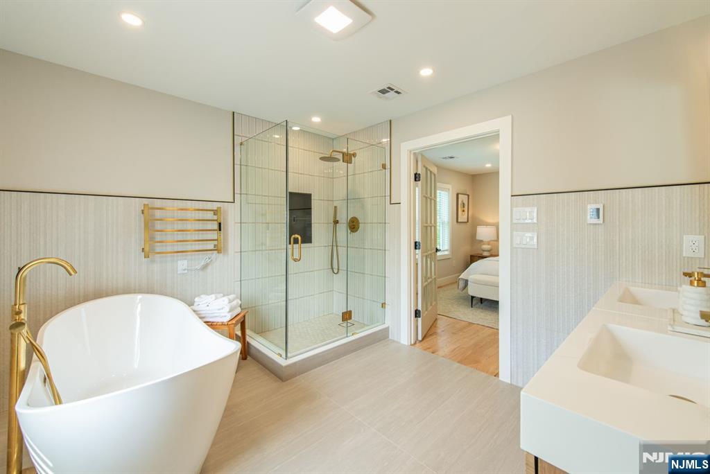 43 Alexander Avenue Montclair, NJ 07043 - Photo 27 of 50 a spacious bathroom with a tub and shower