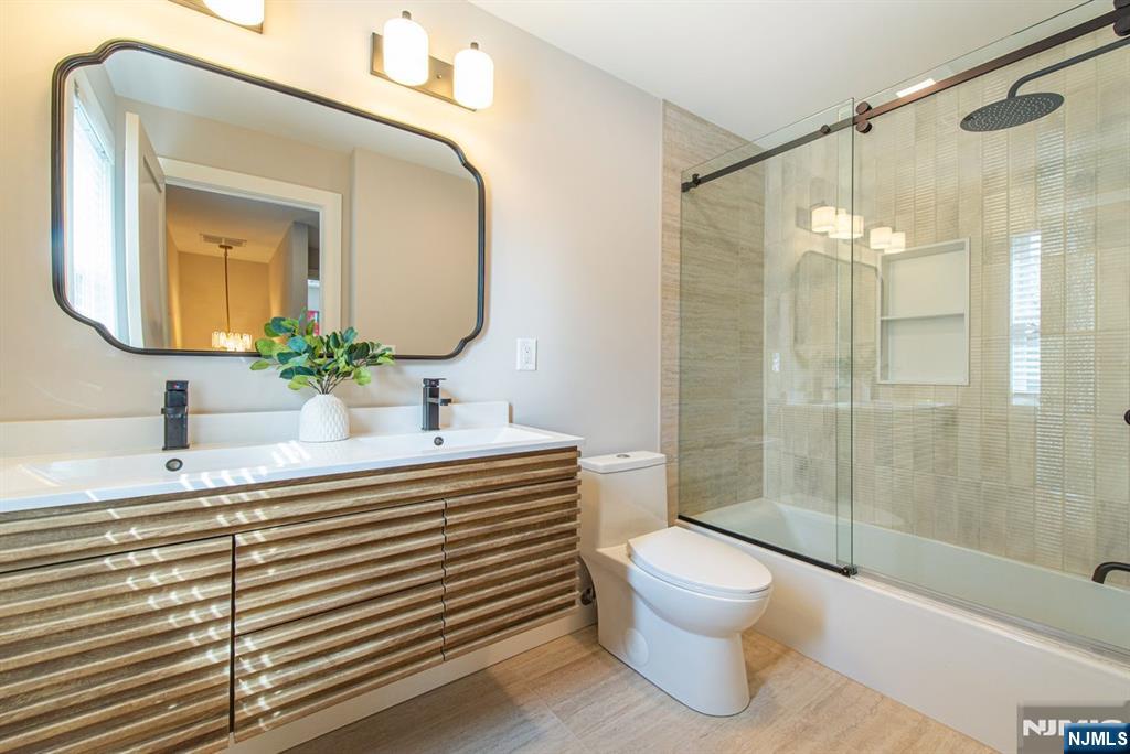 43 Alexander Avenue Montclair, NJ 07043 - Photo 32 of 50 a bathroom with a sink a toilet and shower