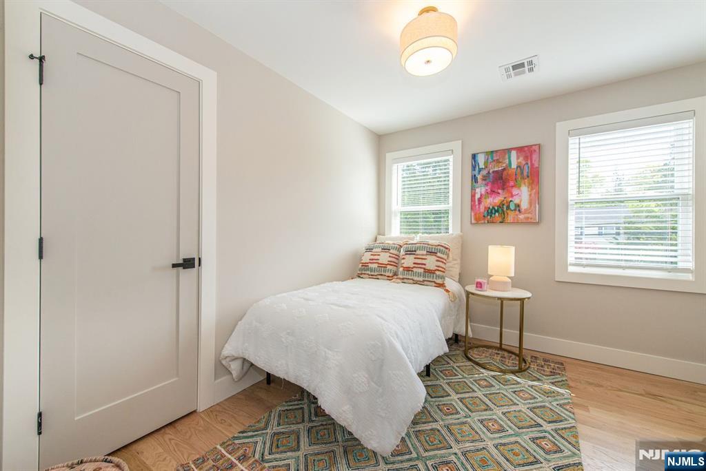43 Alexander Avenue Montclair, NJ 07043 - Photo 33 of 50 a bedroom with a bed and a window
