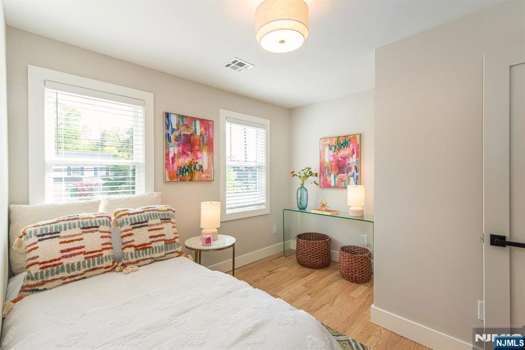 43 Alexander Avenue Montclair, NJ 07043 - Photo 34 of 50 a bedroom with a bed and a window
